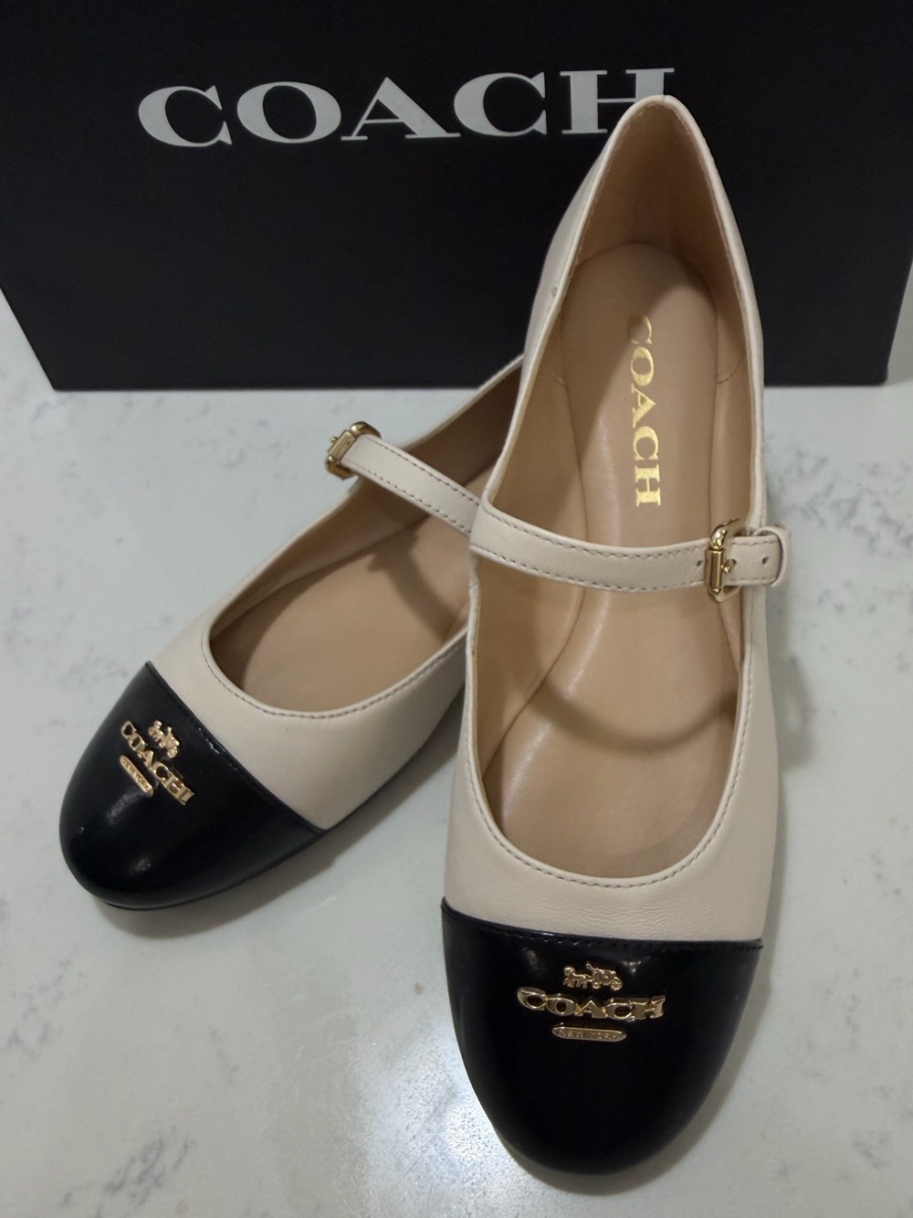 Coach Cream Leather Mary Janes with chalk/Black Patent Cap Toe and Gold Logo